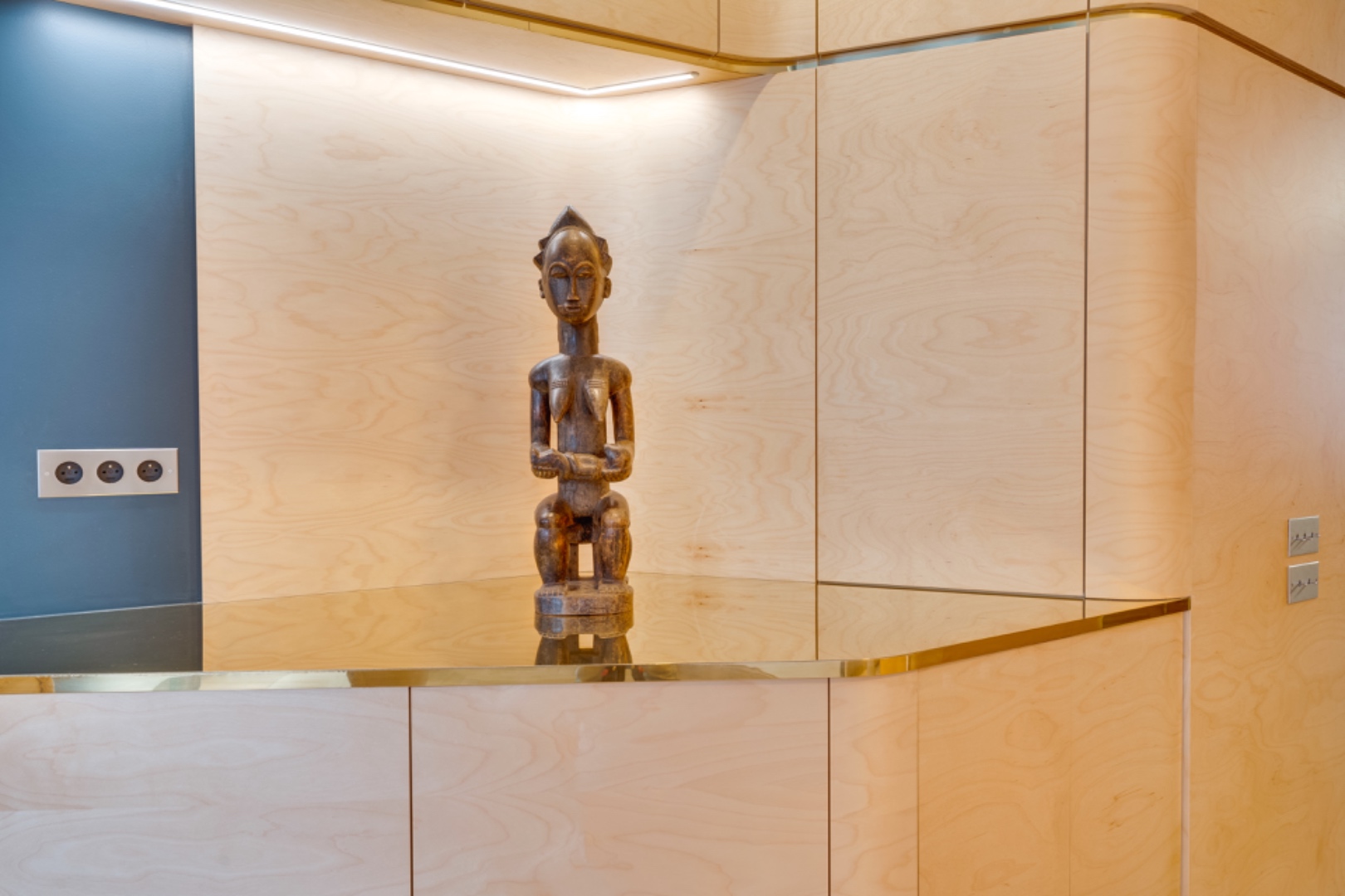 Close detail — brass inlay and maple veneer